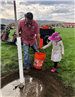 IMG_6102 TJ carrying bucket with little girl pink hat